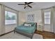 Comfortable main bedroom with large windows and ample natural light at 2450 Dovesong Trace Dr, Ruskin, FL 33570