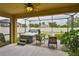 Relaxing screened-in patio with a spa, comfortable seating, and serene backyard views at 2450 Dovesong Trace Dr, Ruskin, FL 33570