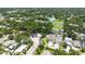 Wide aerial view of the house featuring lush tree coverage throughout the community at 2596 Floyd St, Sarasota, FL 34239