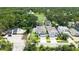 Aerial view of house featuring a pool and community amenities in a lush green, planned community at 2596 Floyd St, Sarasota, FL 34239