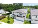 Birds eye view of the house, lush landscaping, green lawn, and the community at 2596 Floyd St, Sarasota, FL 34239