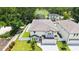 Aerial view of the house and pool showcasing the backyard and surrounding lush landscaping at 2596 Floyd St, Sarasota, FL 34239