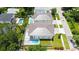 Aerial view of the home showcasing the pool, patio and lush landscaping at 2596 Floyd St, Sarasota, FL 34239