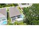 Aerial view of the home with a pool, patio and fenced yard at 2596 Floyd St, Sarasota, FL 34239