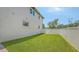 Fenced backyard with manicured lawn and plenty of space for outdoor activities at 2596 Floyd St, Sarasota, FL 34239