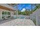 Inviting backyard featuring a sparkling pool, comfortable lounge chairs, and a cozy seating area at 2596 Floyd St, Sarasota, FL 34239
