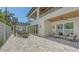 Stunning outdoor living space with a pool, lounge area, and outdoor kitchen beneath a covered balcony at 2596 Floyd St, Sarasota, FL 34239