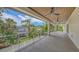 Expansive covered balcony with ceiling fans, wood-finished ceiling, and stunning views at 2596 Floyd St, Sarasota, FL 34239