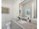 Modern powder room with stylish mirror and elegant fixtures at 2596 Floyd St, Sarasota, FL 34239