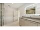 Modern bathroom featuring a vanity with a stone countertop and a frameless glass shower at 2596 Floyd St, Sarasota, FL 34239