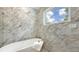 Stylish bathroom with a standalone tub, elegant shower, and marble accents for a spa-like experience at 2596 Floyd St, Sarasota, FL 34239
