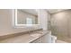 Clean bathroom with modern lighting, shower, and floating vanity for a modern look at 2596 Floyd St, Sarasota, FL 34239