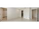 Spacious bedroom with walk-in closet, en suite bathroom, and multiple doorways offering seamless transition at 2596 Floyd St, Sarasota, FL 34239