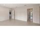 Neutral Primary bedroom featuring tile flooring and ensuite bathroom with tiled shower at 2596 Floyd St, Sarasota, FL 34239