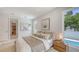 Bright bedroom with an en-suite bathroom, view of the pool, and comfortable decor at 2596 Floyd St, Sarasota, FL 34239