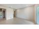 Modern bedroom with an ensuite bathroom, recessed lighting, and sliding glass doors with treetop views at 2596 Floyd St, Sarasota, FL 34239