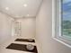 This bright yoga room features neutral paint, recessed lights and a window at 2596 Floyd St, Sarasota, FL 34239