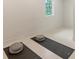 Calm yoga room features a window, neutral color palette and two yoga mats at 2596 Floyd St, Sarasota, FL 34239