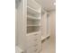 Custom designed closet with built-in shelving, drawers, and closet rods for optimal storage and organization at 2596 Floyd St, Sarasota, FL 34239