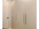 Closet with minimalist white panel doors and simple silver hardware at 2596 Floyd St, Sarasota, FL 34239
