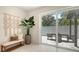 View from the dining area out to the outdoor patio area and tropical landscaping at 2596 Floyd St, Sarasota, FL 34239
