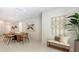 Bright and open dining area features modern seating and leads to the kitchen and living areas at 2596 Floyd St, Sarasota, FL 34239