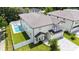 Exterior elevation with manicured lawn and in-ground pool with privacy fence at 2596 Floyd St, Sarasota, FL 34239
