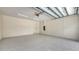 Spacious garage with painted walls and epoxy flooring at 2596 Floyd St, Sarasota, FL 34239