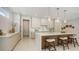 Gourmet kitchen with an island, breakfast bar, modern cabinets, and stainless steel appliances at 2596 Floyd St, Sarasota, FL 34239