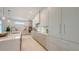 Bright kitchen featuring stainless steel appliances, custom cabinets, and ample counter space at 2596 Floyd St, Sarasota, FL 34239