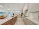 Modern kitchen with island, stainless appliances, custom cabinets, and lots of natural light at 2596 Floyd St, Sarasota, FL 34239