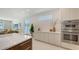 Modern kitchen featuring stainless steel appliances, white cabinets, and lots of natural light at 2596 Floyd St, Sarasota, FL 34239