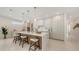 Modern kitchen with an island, bar seating, modern cabinets, and stainless steel appliances at 2596 Floyd St, Sarasota, FL 34239