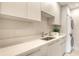Clean laundry room featuring a counter with sink, washer, and dryer at 2596 Floyd St, Sarasota, FL 34239