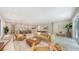 Expansive living area integrating modern decor and an open layout that connects the living, dining, and kitchen spaces at 2596 Floyd St, Sarasota, FL 34239