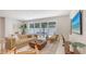 Bright living room with sliding glass doors, stylish furniture, and chic decor, perfect for both relaxing and entertaining guests at 2596 Floyd St, Sarasota, FL 34239