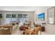 Stylish living room with sliding glass door leading to outdoor area, modern furnishings, and natural light at 2596 Floyd St, Sarasota, FL 34239