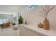 Open-concept space with living room and bar featuring neutral color palette and large windows at 2596 Floyd St, Sarasota, FL 34239