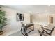 Upstairs loft space features a desk, seating, artwork, and lots of natural light at 2596 Floyd St, Sarasota, FL 34239