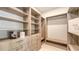 Custom walk-in closet with open shelving, drawers, and ample storage at 2596 Floyd St, Sarasota, FL 34239