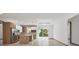 Open-concept living space with a modern kitchen, dining area, and access to the backyard at 299 Australian Dr, Rotonda West, FL 33947