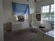 Bedroom with natural light, a dresser, and a desk, with a view of the outdoors at 3006 Hawthorne St, Sarasota, FL 34239