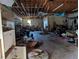 Spacious garage area cluttered with furniture and items scattered on the floor at 3006 Hawthorne St, Sarasota, FL 34239