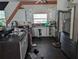 Kitchen featuring white cabinets, dark countertops, and stainless steel appliances at 3006 Hawthorne St, Sarasota, FL 34239