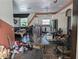 Spacious living room and kitchen area needing decluttering and cleanup at 3006 Hawthorne St, Sarasota, FL 34239
