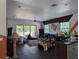 View of the open concept living room leading to an outdoor balcony at 3006 Hawthorne St, Sarasota, FL 34239