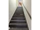 View of the stairway leading to the upper level of the home at 3006 Hawthorne St, Sarasota, FL 34239