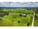Expansive parcel with lush green acreage and pond offers serene country living and privacy at 3100 Lena Ln, Sarasota, FL 34240
