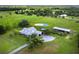 Beautiful property featuring a spacious house, barn and pool, set amongst lush landscaping at 3100 Lena Ln, Sarasota, FL 34240