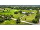 Gorgeous farmhouse with pond and barn on a picturesque property surrounded by lush greenery at 3100 Lena Ln, Sarasota, FL 34240